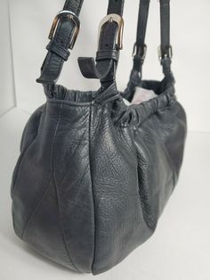 Parisian Signature Black Leather Double Handles Shoulderbag 13x8.5x3.5"~ gently used~ 2 divided 3 sections inside with 2 zipper pockets & 2 open pockets~ 12" adjustable straps with elastic stretchable top opening~ magnetic closure ~ 3.5" bottom stud can carry many items ~ Priority shipping Vintage Satchel With Silver-tone Hardware For Everyday Use, Black Vintage Hobo Shoulder Bag, Vintage Black Hobo Shoulder Bag, Vintage Black Crossbody Hobo Bag, Vintage Black Hobo Bag For Daily Use, Vintage Black Hobo Bag, Vintage Black Soft Leather Bags, Vintage Shoulder Bag With Silver-tone Hardware And Double Handle, Vintage Double Handle Shoulder Bag With Silver-tone Hardware