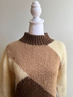 Vintage acrylic ski sweater Diagonal graphic knit pattern Mid collar Cream, tan and chocolate brown Super soft and classic Size Men's Small Shoulder to shoulder 17" Chest 38" Length 25" Sleeve 23" Retro Beige Knitted Sweater, Beige Knitted Retro Sweater, Fitted Brown Crew Neck Sweater, Brown Argyle Pattern Long Sleeve Sweater, Retro Brown Knit Sweater, Brown Argyle Long Sleeve Sweater, Brown Retro Knit Sweater, Brown Long Sleeve Argyle Sweater, Cream Retro Winter Sweater