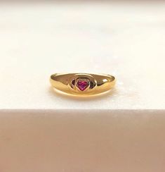 "\"Be Mine\" Dainty Pink Heart Stone Signet Ring with Ruby Cubic Zirconia Crystal. This ring shouts LOVE and PASSION in the most subtle way possible!💞 So simple and sensual ✨The PERFECT dainty LOVE Ring! Ways to Wear: Pinky finger and Index finger💞 Ruby Represents: Love, Energy, Passion, Power, and Zest of Life💖 Handmade Item 💕😊 ENJOY ! Material 18K-Gold Plated over Solid Sterling Silver Gemstone: Cubic Zirconia Lead & Nickel free Details Ruby Cubic zirconia (Red/Pink) Diamond cut stone Ring With Ruby, Pinky Finger, Ruby Heart, Gold Heart Ring, Heart Padlocks, Swarovski Crystal Hearts, Ring Ruby, Ring Heart, Heart Stone