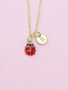 This is an alloy red ladybug charm with hand stamped initial charm on a stainless-steel or brass chain. ♥ You will receive 1 necklace. HOW TO ORDER 1) Select the quantity 2) Select the stamp and finish. 3) Add to cart DESCRIPTION ♥ Necklace, Stainless Steel or Brass Cable Chain 18 inches, Nickel Safe. ♥ Initial Charms, Stainless steel, Size: about 8-10mm in diameter, 1mm thick, Nickel Safe, ♥ Alloy Enamel Charms, 3D Ladybug Charms, Golden, Size: about 0.35 inch(9mm) wide, 0.49 inch(12.5mm) long, Dainty Personalized Small Charm Necklaces, Dainty Personalized Small Charm Necklace, Nickel-free Red Themed Jewelry, Nickel-free Themed Red Jewelry, Themed Red Nickel-free Jewelry, Novelty Necklace With Lobster Clasp For Gift, Personalized Charm Necklace For Birthday, Personalized Novelty Charm Necklace For Birthday, Adjustable Round Pendant Charms For Gifts