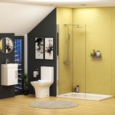 a modern bathroom with yellow walls and white fixtures, including a walk - in shower