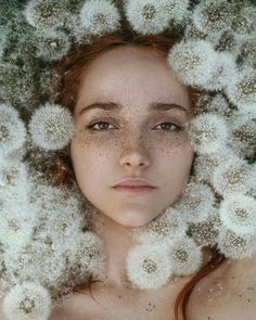 a woman with dandelions on her head is shown in the middle of an image