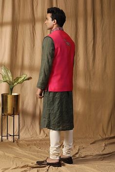 Pink silk dual toned bundi with ancient motif embroidery. Paired with a green contrasting kurta and off white churidar. - Aza Fashions Traditional Green Bandhgala With Stand Collar, Ceremonial Green Nehru Jacket With Chikankari Embroidery, Green Outerwear For Festive Diwali, Festive Outerwear With Woven Motifs, Off White Churidar, Kurta Set Men, White Churidar, Motif Embroidery, Kurta Set For Men