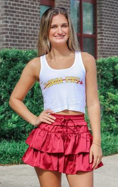 Love a cute, cropped game day tank?! Our "Florida State" Vintage Crop Tank in White is the perfect match for all your fun shorts and skirts. Plus, it's lightweight and breathable, mixed with a super cute retro graphic! Details: *OFFICALLY LICENSED* Super Soft, & Stretchy Tank 50% Cotton, 50% Modal Crew Neckline, No Sleeve, Crop Length Features a Garnet Arrow Graphic under Gold Lettering, Center Chest Color: White True to Size: Relaxed fit Jaden is wearing size Small Garment measurements in inches: Small = Bust: 12 3/4” / Length: 17” Medium = Bust: 13” / Length: 17 3/4” Large = Bust: 13.5” / Length: 17 3/4” X- Large = Bust: 14.5” / Length: 18” Have questions about sizing, fit, or styling? Send us a chat or give us a call at 850-629-4890 during business hours 11AM - 5PM EST Monday-Friday! Arrow Graphic, Fun Shorts, Tallahassee Florida, Fashion Bottoms, Gold Lettering, Georgia Bulldogs, Alabama Crimson, Florida State, Alabama Crimson Tide