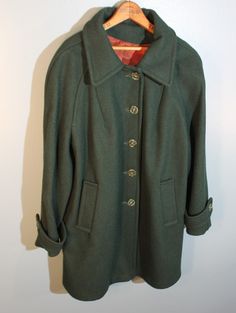 "Vintage, 1950s, green wool peacoat. Handmade in the USA by the International Ladies Garment Workers Union. Gently worn. In overall nice condition without rips or stains. Women's Medium Length, 32\" Underarm to underarm, 21\" Sleeves, 26\"" Classic Green Wool Coat, Green Wool Long Pea Coat, Classic Green Pea Coat With Button Closure, Vintage Wool Outerwear With Buttons, Fitted Green Wool Coat, Fitted Long Green Pea Coat, Classic Green Wool Coat For Fall, Vintage Pea Coat With Buttons For Fall, Vintage Pea Coat With Button Closure