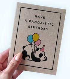 a hand holding a card with a panda -istic birthday design