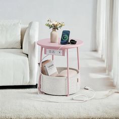 a pink table sitting on top of a white rug