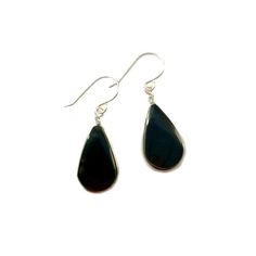 These black stone earrings include two genuine Obsidian stones from Peru dangling beneath a feminine French ear wire. The black, teardrop shaped semiprecious gemstones have a grooved edge in which the premium quality metal wire is wrapped. Choose your finish: 925 Sterling Silver or 14K gold fill.The wirework is handwoven in my art jewelry studio on the beautiful island of Martha's Vineyard. The earrings are approximately 1.25 inches long as measured from the center of the French ear loop to the Classic Black Earrings With Polished Finish, Minimalist Natural Stone Teardrop Earrings, Modern Black Long Drop Jewelry, Nickel Free Black Teardrop Jewelry, Black Dangle Earrings For Everyday, Black Drop Earrings For Everyday, Nickel-free Black Teardrop Jewelry, Black Teardrop Jewelry With Matching Earrings, Black Teardrop Modern Jewelry