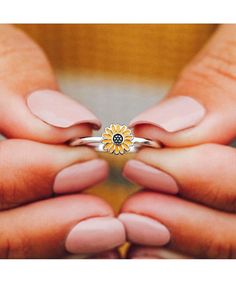 Need a little flower power? Then snag our Sunflower Ring! This too-cute style is set on a silver band, with a brightly enameled sunflower charm for the perfect pop of color. - Size 5, 6, 7, 8, 9- Brass Base w/ Rhodium Plating & Enamel- Sunflower Measurements: 7mm (diameter)- Final Sale - No Returns or Exchanges Sunflower Charm, Sunflower Ring, Pura Vida Bracelets, Sunflower Earrings, Gel Tips, Enamel Ring, Silver Band, Handmade Bracelets, Costa Rica