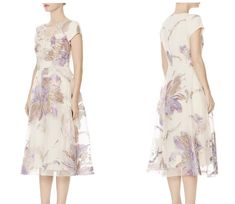 the dress is white and has purple flowers on it