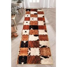 a multicolored area rug with an animal print pattern on the bottom and sides