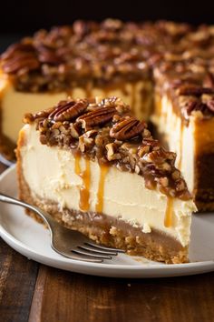 a piece of cheesecake with pecans on top