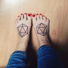 a woman's feet with tattoos on them