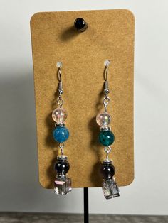 Handmade Earrings - Colors Series Each piece is meticulously handcrafted using craft wire, hypoallergenic earring hooks, and premium beads including crystal, glass, wood, ceramic, acrylic, resin, stone, and silicone beads. Care Instructions: Avoid moisture. Remove prior to bathing, showering, swimming, or exercising. Avoid allowing the item to fold when storing.  Shipping Information: Your items will be shipped within 1-2 business days once payment is received. Shipping within the US is via first class mail or you may choose to upgrade to Priority Mail for a small fee. Each item is carefully wrapped and packaged for safety during transit. Returns & Exchanges: As this is a wearable item, I do not accept returns or exchanges on this item. All sales are final. If there is a problem once your Adjustable Beaded Glass Earrings, Dangle Crystal Earrings With Czech Glass For Gift, Czech Glass Dangle Crystal Earrings For Gift, Czech Glass Crystal Dangle Earrings As Gift, Beaded Glass Drop Earrings, Nickel-free Glass Beaded Dangle Earrings, Bohemian Resin Earrings With Ear Wire, Unique Beaded Earrings With Czech Glass, Dangle Crystal Earrings As Gift