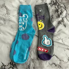 Pixar - Crew Sock Bundle - Includes Two Crew Socks (One Turquoise Pair Featuring Sully From Monsters Inc And One Grey Pair With Smiley Faces And Mickey Heads) - Adult Size, One Size Fits Most - Never Worn Or Displayed, Brand New Without Tags Trendy Blue Socks For Winter, Trendy Blue Winter Socks, Playful Blue Cotton Socks, Casual Multicolor Socks For Streetwear, Trendy Gray Cotton Socks, Cute Blue Socks For Stocking Stuffers, Fun Blue Cotton Socks, Monsters Inc Sock, Sully From Monsters Inc