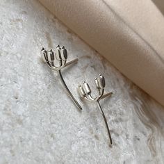 Flower Stud Earrings, 925 Silver Earrings, Cute Earrings, Unique Earrings, Nature Lover Jewelry, Women Jewelry, Gift for her Designed and made in the USA Love ♥ jewoloji | Made with 925 Silver , ~ 2.5 gr MAKING DAINTY JEWELRY WITH SILVER IS DIFFICULT, BECAUSE SILVER IS SO SOFT. WHEN YOU USE THESE EARRINGS PLEASE BE GENTLE. MAKE SURE YOU STORE THEM IN PLASTIC BAGS, IN A DARK PLACE WITH LOW HUMIDITY TO PREVENT TARNISH FOR A LONGER TIME. jewoloji DOES NOT USE NICKEL PLATE FOR SILVER COVERING FOR SENSITIVE SKINS. SO IT IS NATURALLY POSSIBLE TO OXIDIZE. THERE ARE LOT OF  MATERIALS TO REFRESH IT AGAIN. MAKE SURE IT IS SILVER FRIENDLY ! ♥ SHIPPING  | All jewelry is packaged in a jewelry box that is chic and elegant, suitable both for keeping and gifting. | Free and Fast Domestic Shipping in the U Sterling Silver Pierced Ear Climbers As Gift, White Gold Ear Climbers Gift, White Gold Ear Climbers With Matching Earrings As Gift, White Gold Ear Climbers As A Gift, Silver Ear Climbers As A Gift, Elegant Silver Ear Climbers As Gift, Silver Pierced Ear Climbers For Anniversary, Sterling Silver Ear Climbers For Anniversary, Sterling Silver Single Flower Earring For Anniversary