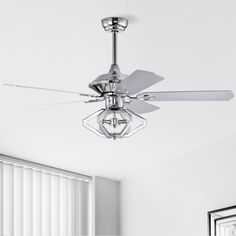 a ceiling fan in a room with white walls