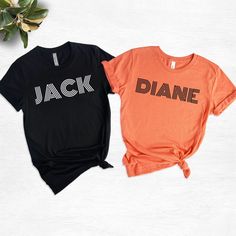 Jack And Diane T-Shirts, Couples Halloween Costumes, Halloween Husband and Wife Tees, His And Hers Halloween Shirts, Matching Halloween Tees We wish everyone to smile with our cute, stylish, and trendy graphic T-shirts. We assure you this shirt is the perfect gift whether you buy it for yourself or someone else. Black text is only used for White, Athletic Heather, Baby Blue, Natural, Orange, Yellow, Heather Peach, Pink, Mint, Cancun, Banana Cream, and Desert Pink colored shirts. White text is us Black Halloween T-shirt With Text Print, Black Halloween Top With Text Print, Black Band Merch T-shirt With Name Print, Halloween Black T-shirt With Text Print, Couples Halloween Costumes, Desert Pink, Matching Halloween, Couples Halloween, Couple Tshirts