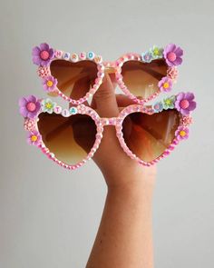 What's more adorable than mamas feeling extra and herself wearing these Floral Bloom Sunnies. It's a whole lot of vibes. Please note that flower charms are subject to stock. Pick the flower colors for the bigger ones to be at the corner and the rest of the flowers will be randomly selected unless a request is placed in the personalisation box. Not to worry, designs are always adorable. This listing is for 1 Pair of Adult sunnies only. Mama and Mini Matching ones available on other listing. What Cute Summer Sunglasses For Birthday, Summer Birthday Sunglasses With Tinted Lenses, Summer Tinted Sunglasses For Birthday, Customizable Cute Summer Sunglasses, Cute Personalized Summer Sunglasses, Cute Customizable Sunglasses For Beach, Customizable Pink Sunglasses For The Beach, Fun Multicolor Sunglasses For Festivals, Fun Multicolor Festival Sunglasses