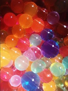 many different colored balls are in the dark