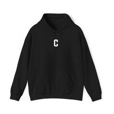 Stay cozy and stylish with our Letter C Print Unisex Heavy Blend™ Hooded Sweatshirt. This minimalist design is perfect for the autumn and winter seasons, offering a clean and modern look. A thoughtful gift for anyone who loves simplicity and comfort, this pullover jacket is a wardrobe staple that combines warmth with understated elegance. Color Accuracy: Please note that actual item colors may differ slightly. This is because computer monitors and phone screens can display colors differently, and individual perception of color varies. While I strive to make my photos as true to life as possible, the color you see on your screen may not perfectly match the item's actual color. Care Instructions: - Do not dry clean - Machine wash: warm (max 40C or 105F) - Do not bleach - Tumble dry: low heat Cozy Winter Hoodie With Letter Print, Cozy Hooded Sweater With Letter Print, Branded Hooded Hoodie For Winter, Branded Fleece Sweatshirt For Winter, Cozy Fleece Hoodie With Letter Print, Cozy Hoodie With Letter Print, Winter Hoodie Sweatshirt With Branding, Branded Winter Hoodie, Cozy Hooded Hoodie With Letter Print