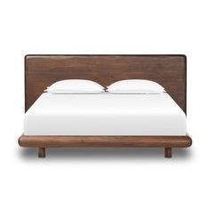 the headboard and foot board are made from wood, with white sheets on it