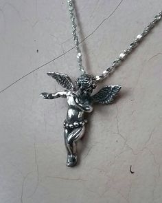 "cherib pendant Open winged Sterling silver 5 gms 30x30mm (1 1/4\") I do have this listed in 9ct yellow gold and can make in Rose gold also..and other metals. Chain or choker is not included..but listed below if you wish to purchase Fine twisted diamond cut chain https://www.etsy.com/your/shops/JewelrywitAttitude/tools/listings/597662247 Neck cuff choker https://www.etsy.com/your/shops/JewelrywitAttitude/tools/listings/597672747 Heavy belcha oval link rollo chain https://www.etsy.com/your/shops/ Star Goddess, Fairy Ring, Horseshoe Ring, Lucky Horseshoe, Angel Pendant, Fairy Angel, Skull Ring, Diamond Cut, Silver Heart