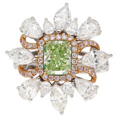 GIA Certified 1.39 carat radiant cut fancy intense yellowish green diamond ring. Adorned with 4 marquise and 8 pear cut diamonds, weighing 2.8 cttw. Bezel set center stone with 26 round diamonds (0.44cttw) and 38 round cut pink diamonds (0.19 cttw) forming a halo. The ring is crafted in 18k white and rose gold, weighing a total of 7.59 grams. This Fancy Intense Yellowish Green Diamond, one of the rarest shades in the world of Fancy Color Diamonds. Encircling this vibrant gem is a delicate floral Green Diamond Ring, Green Diamond Rings, Yellowish Green, Pink Diamonds, Yellow Diamond Rings, Fancy Lights, Colored Engagement Rings, Pear Cut Diamond, Contemporary Ring