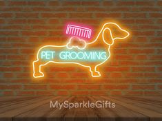 a neon sign that says pet grooming with a dachshund on it