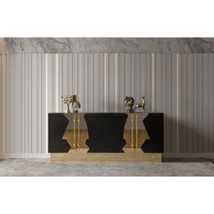 two black and gold sideboards in front of a striped wall