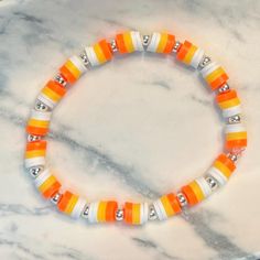 ⭐️⭐️⭐️ See more items like this in our store: https://hgscreationsfl.etsy.com. Make your fall more festive with this fun candy corn inspired heishi bracelet set! Silver accent bracelet made with genuine sterling silver beads. Refer to the size chart provided for a guideline of recommended sizing.  ✰ Due to the handmade nature of this jewelry, slight variations from the examples shown may occur. Please double check spelling, sizing, and all other details before placing your order. Because each bracelet is custom made, all sales are final. All items are created and shipped from a smoke-free home.  CARE INSTRUCTIONS ✰ To keep your jewelry looking great, I recommend keeping it away from water, lotion, perfumes, etc. Please note that accent beads are capable of tarnishing over time. Be sure to Fall Pony Bead Bracelets, Clay Beads Bracelet Halloween, Candy Corn Beaded Bracelet, Candy Corn Bracelets, Fall Clay Beads Bracelet Ideas, Ideas For Beaded Bracelets, Fall Clay Bead Bracelet Ideas, Fall Bracelet Ideas, Halloween Bracelet Ideas