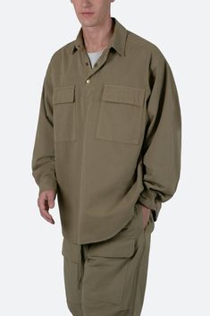 the Oversized Utility Shirt is designed with an oversized fit and features a drop shoulder sleeve construction, 1/4 button placket, a scoop hem, and finished in a cotton fabric. details 100% cotton oversized fit model is 6’0, 140 lbs and wears a size medium Sleeve Construction, Drop Shoulder Sleeve, 140 Lbs, Utility Shirt, Fabric Details, Button Placket, Shoulder Sleeve, Types Of Shirts, Oversized Fits