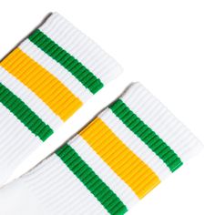 White athletic socks with green and gold stripes for men, women and children. White Cotton Retro Socks, Retro White Cotton Socks, Trendy White Streetwear Socks, Trendy White Socks For Streetwear, Sporty White Socks For Streetwear, White Casual Socks For Sports Events, Casual White Socks For Sports Events, White Casual Socks With Three Stripes, Casual White Socks With Three Stripes