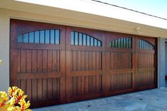 an image of a garage door that is brown in color and has windows on the side