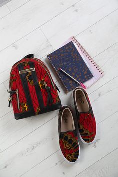 African Print Womens Backpack, Ethnic Kids School Mini rucksack, Traditional Kente Ankara Multicoloured Red Ladies Shoulder Bag - CORDELIA LAVIYE's African Print Women's Backpack will suit your personal expression for African fashion. Whether your a student, frequent traveller or on-the-go mom, LAVIYE's stylish African Kente Backpack will come handy. LAVIYE's African backpack has a soft padding that provides comfort and holds the shape of the bag in place. Our African print backpack is spacious enough for your tablets, books, makeup bag etc & can be carried by adults and kids. Designed to match LAVIYE's African print casual sneakers CALABAR. Shop the matching CALABAR Shoes HERE  https://www.etsy.com/shop/laviye/ Matching outfits for the whole family available in the Cordelia & Charles Coll Casual Red Bags For Trips, Ankara Backpack, African Print Shoes, Ankara Fashion, Slip On Pumps, Print Shoes, Print Sneakers, African Print Fabric, Shoe Print