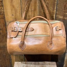 "Material : 100% Real Leather     Height : 14\"(36cm) / Width : 19\"(48cm) / Depth : 8.5\"(21cm) / Weight: 1kg  approximately, This medium tunnel shape bag is handmade of 100% real veg tan leather. Well-known weekend bag. It also used as a gym bag because of its capacity. Hand luggage for a short break or work. This superb travel bag made of several components;     1 large compartment     Top zip closure     2 side pockets     Brass buckles Adjustable leather straps and fully lined This bag has Classic Bags With Top Carry Handle For Trip, Brown Leather Lined Shoulder Bag For Overnight Trips, Brown Rectangular Satchel For Trips, Leather Bags With Luggage Sleeve, Vintage Leather Shoulder Travel Bag, Vintage Shoulder Bag With Luggage Sleeve For Travel, Leather Satchel With Luggage Sleeve For Weekend Trips, Leather Satchel For Overnight Trips With Large Capacity, Leather Duffle Bag With Top Carry Handle For Trip