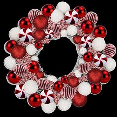 a christmas wreath with red and white ornaments