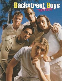 the backstreet boys are posing for a photo in front of some palm trees