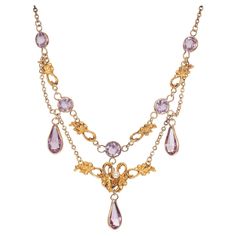 Victorian, 1900's Pearl and amethyst drop necklace. 5 round amethysts with 3 pear shaped amethyst dangles. in 14k yellow gold with one round center pearl. 18.5 inches in length. One 2.7mm natural pearl 5 round Amethyst, approx. total weight 2.40ct 3 pear shaped Amethyst, approx. total weight 4.00ct, 10 x 5mm 14k Yellow Gold Tested: 14k 7.4 grams Cable chain: 1.8mm Length: 18 1/2 inches Victorian Pendant Necklace, Pearl And Amethyst, Art Deco Pendant Necklace, Bijoux Art Nouveau, White Gold Pendant Necklace, Victorian Pendants, Pearl Drop Necklace, Beautiful Fairy, Princess Jewelry