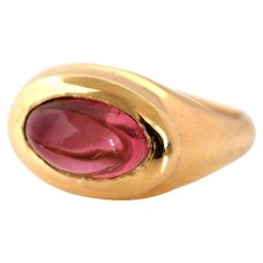 Discover our Signet 18ct Gold Cabochon Tourmaline Ring, handcrafted by Master Goldsmiths in London. Featuring a captivating high cabochon pink tourmaline weighing 3.42ct. The smooth, polished cabochon cut enhances the gemstone's natural beauty and colour, perfectly complemented by the rich 18ct gold setting. Tourmalines are a symbol of peace and balance. Its vibrant pink hue makes it an attractive choice for anyone seeking emotional healing and wisdom. MEASUREMENTS Tourmaline - 3.42ct (Origin, M Yellow Gold Tourmaline Cabochon Ring, Tourmaline Bezel-set Oval Cabochon Ring, Tourmaline Bezel Set Ring In Oval Cabochon, Tourmaline Ring With Bezel Setting In Oval Cabochon, Classic Pink Cabochon Rings, Peace And Balance, Symbol Of Peace, Resize Ring, Signet Rings