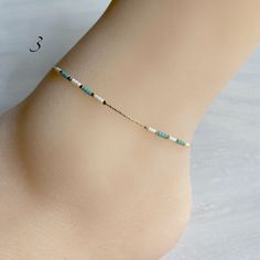 "Beaded ankle bracelet in three styles. Dainty chain with tiny beads. Gold plated brass chain. Chain length: 8.5\" Extension: 1.75\"" Summer Gift Beaded Chain Anklets, Adjustable Beaded Chain Anklets For Summer, Minimalist Hypoallergenic Anklets For Summer, Hypoallergenic Minimalist Summer Anklets, Adjustable Delicate Chain Bracelets For Summer, Dainty Adjustable Chain Anklets For Summer, Adjustable Delicate Chain Bracelet For Summer, Dainty Adjustable Nickel-free Anklets, Minimalist Delicate Chain Anklet For Summer