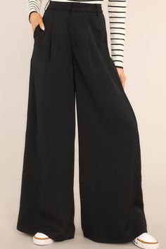 Be the talk of the office in these Office Chic Black Pants! Show 'em who's boss while flaunting your fashion in these timeless versatile black trousers - guaranteed to keep you chic and professional for any occasion. Look effortless when you step into the office. These pants feature a high waist fit, a hook and bar closure, belt loops, pockets, and a wide leg. 100% Polyester Hand Wash Cold Unlined Imported Model is wearing a size small Chic Black Pants, Office Chic, Black Wide Leg Pants, Red Dress Boutique, Chic Office, Black Trousers, Boutique Dresses, Hip Length, Leg Pants