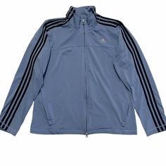 This jacket is in excellent used condition, no known flaws. Long sleeves. Three black stripes down the arms. Zipper pockets. Front zipper closure. Mock turtleneck. Stretchy. Casual. Activewear. Running. Sports. Track jacket. See pictures for measurements. ADIDAS Light Blue Lightweight Zipper Track Jacket XL. Adidas Blue Outerwear With Three Stripes, Adidas Blue Outerwear With Three Stripes Branding, Adidas Blue Track Jacket With Three Stripes, Blue Adidas Sporty Windbreaker, Adidas Blue Sporty Windbreaker, Sporty Blue Adidas Windbreaker, Blue Adidas Windbreaker For Sports, Blue Adidas Sports Windbreaker, Adidas Casual Track Jacket For Gym