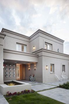 a house with a bicycle parked in the driveway