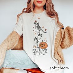 Retro Dancing Skeleton Shirt | Vintage Halloween Graphic Tee | Trendy Spooky Skeleton T-Shirt | Fun Halloween Fall Shirt | Halloween Apparel **FOR A RELAXED FIT, CHOOSE YOUR GO-TO SIZE. TO ACHIEVE AN OVERSIZED, T-SHIRT DRESS, WE RECOMMEND GOING UP 2-3 SIZES. ABOUT THIS AWESOME SHIRT ... -These are a Bella Canvas branded t-shirts that are known for their comfort and sustainability. They have UNISEX sizing - which means the women's size you most often wear, will have a looser fit. Please refer to Novelty T-shirt With Funny Print For Fall, Fall Novelty T-shirt With Funny Print, Fall Skull Print Short Sleeve Tops, Funny Print Novelty T-shirt For Fall, Fall Skull Print Cotton T-shirt, Fall Skull Print Short Sleeve T-shirt, Fall Cotton T-shirt With Skull Print, Fall Novelty Cotton Tops, Fall Crew Neck Shirt With Skull Print