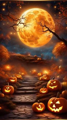 a halloween scene with pumpkins on the ground and a full moon in the background