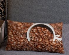 a pillow that has coffee beans on it