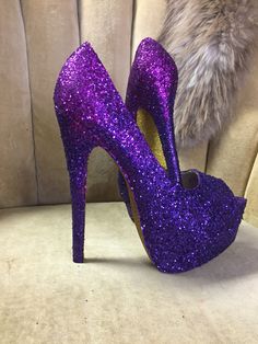 "These beautiful ombré heels are covered in a royal purple glitter starting at the toes and gradually transitions into a pink based purple glitter near the backs of the heels. This glitter is a chunky/ ultra fine mix that creates an exceptional sparkle and insures that every teeny tiny MM is covered by glitter. All of our heels are sealed with a water resistant sealant that also helps to protect the artwork. This heel is available in additional colors and shoe styles and is shown in a tall 6\" h Purple High Heel Party Heels, Glamorous Purple Party Heels, Purple Platform Heels For Party, Purple Open Toe Party Heels, Glamorous Purple High Heels, Purple Party Heels, Purple Glitter High Heels, Wedding Glitter, Purple High Heels