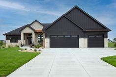 a large house with two garages in the front yard