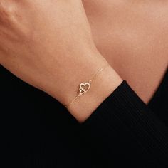 "1- P R O D U C T ∙  D E S C R I P T I O N Showcase your love with our Interlocking Heart Bracelet in 14K Solid Gold. Perfect as a couple bracelet or a stunning gift for her, this double heart bracelet captures the essence of romance. Crafted from 14k solid gold, it adds a touch of luxury to any outfit. This 14k gold jewelry is not just a purchase, but an investment in timeless style. 2- P R O D U C T ∙  D E T A I L S Gold material: 14K solid gold Choice of gold color: Yellow gold, Rose gold, White gold Choice of chain length: 5\", 5.5\", 6\", 6.5\", 7\" +1\" Extender Dimensions: * Height: 9 mm /  0.35 in * Width: 12 mm /  0.47 in 3- S H I P P I N G ∙ A N D ∙ R E T U R N S We know you're excited to get your hands on your order, and we're just as excited to get it in your hands. We take pri Diamond Heart Bracelets As Gift, Diamond Heart Bracelet Gift, Dainty Double Heart Promise Jewelry, Diamond Heart Charm Bracelets For Anniversary, Diamond Bracelets With Heart Charm For Anniversary, Diamond Bracelet With Heart Charm For Anniversary, Elegant Diamond Heart Charm Bracelet, Elegant Diamond Heart Bracelet With Charm, Diamond Heart Cut Bracelet As Gift